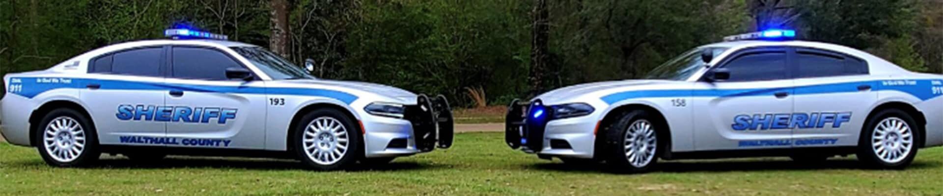 Two Walthall County Sheriff's vehicles facing each other.